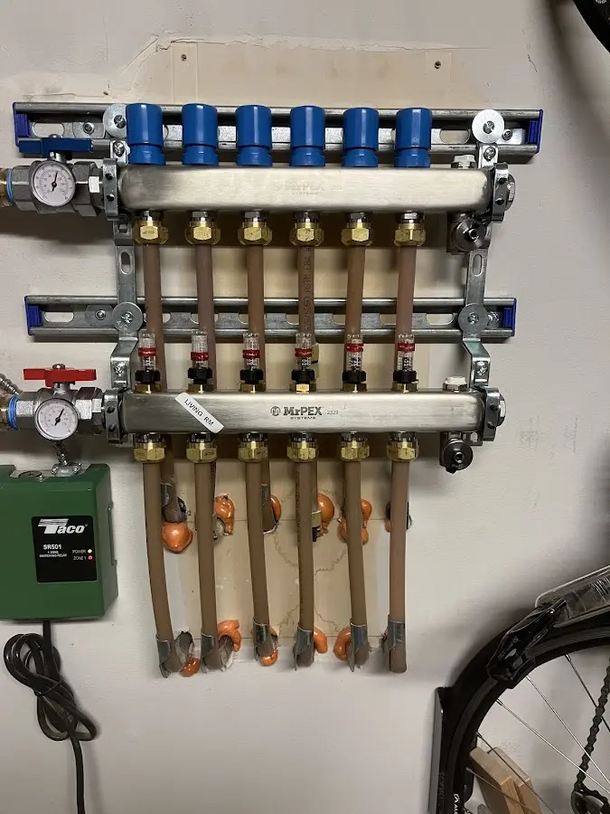 Plumber performing Water Heater Repair at a residential property in Cannon